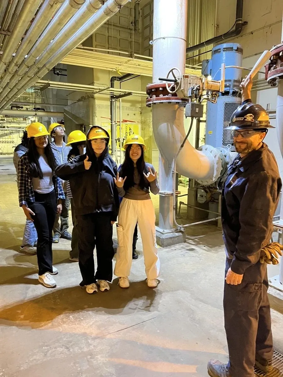 Students wearing hardhats during an industry site visit