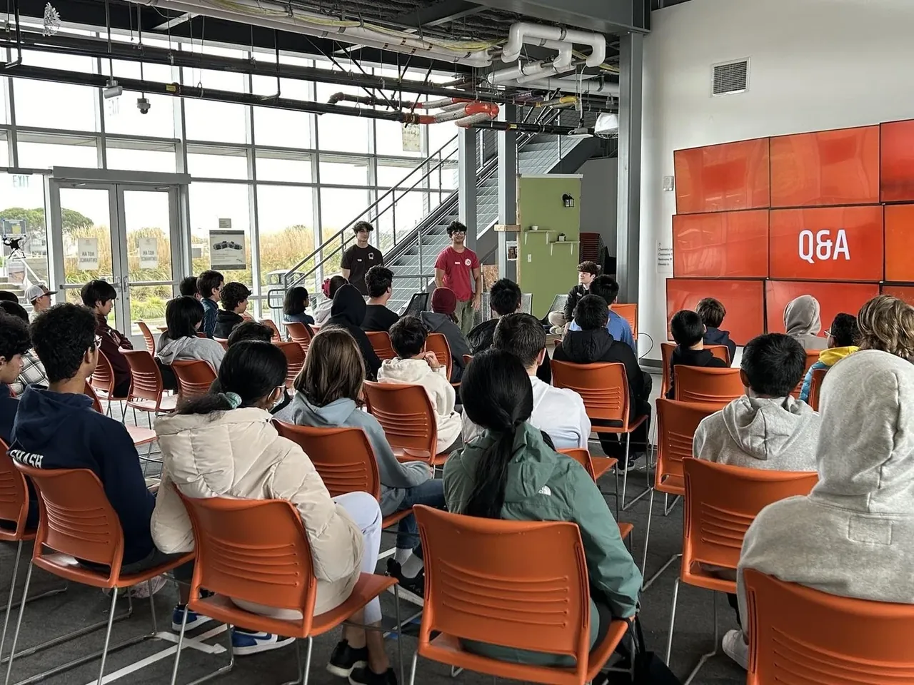 Students gathered for a presentation in a d.tech classroom