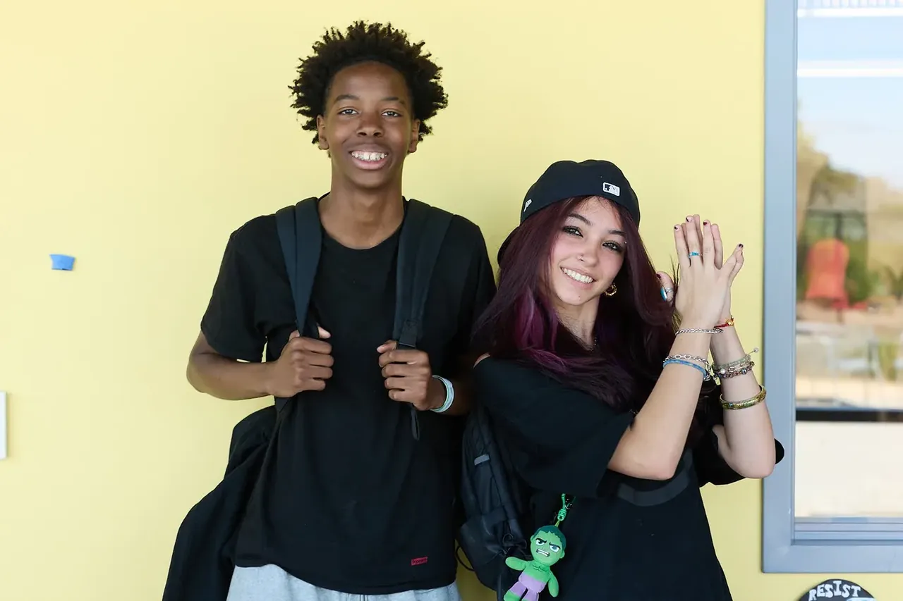 Two d.tech students sharing a moment at school